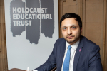 Saqib Bhatti MP signing the Holocaust Educational Trust book of commitment 