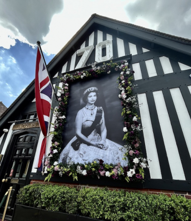Portrait of Her Majesty outside Jacques, Knowle