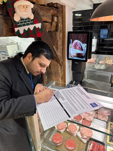 Saqib Bhatti MP signing the petition in Knowle 